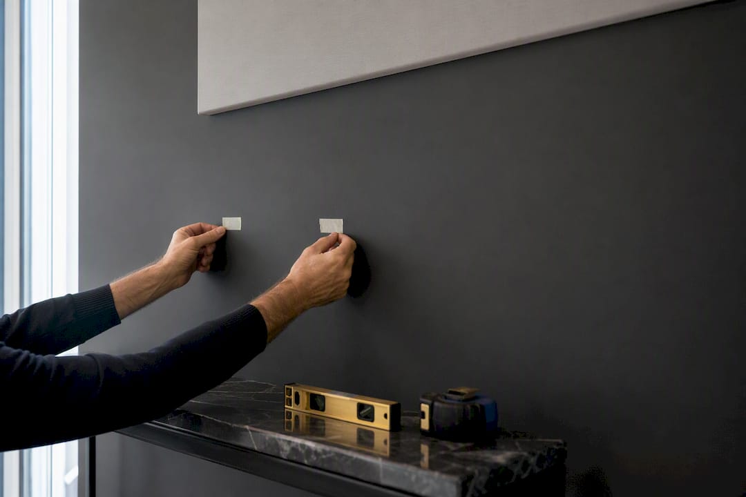 Painter tape marking canvas hanging points
