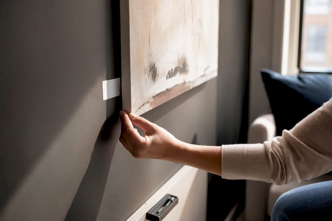 Renter aligning wall art without drilling