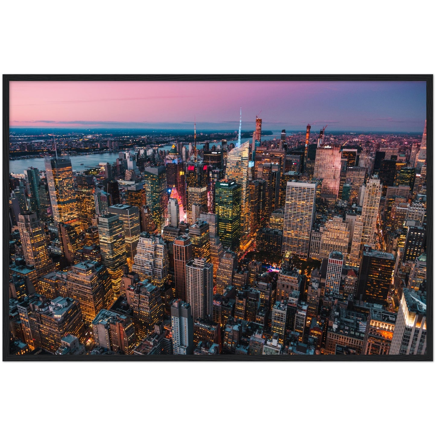 Manhattan Buildings Wall Art: Stunning aerial view of illuminated NYC skyscrapers at sunset. Modern city skyline art print.