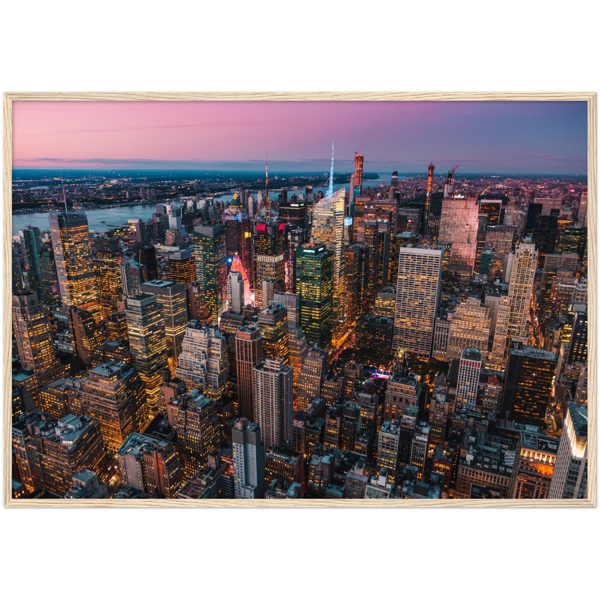 Manhattan Buildings Wall Art: Stunning aerial view of illuminated NYC skyscrapers at twilight. Perfect city skyline decor.