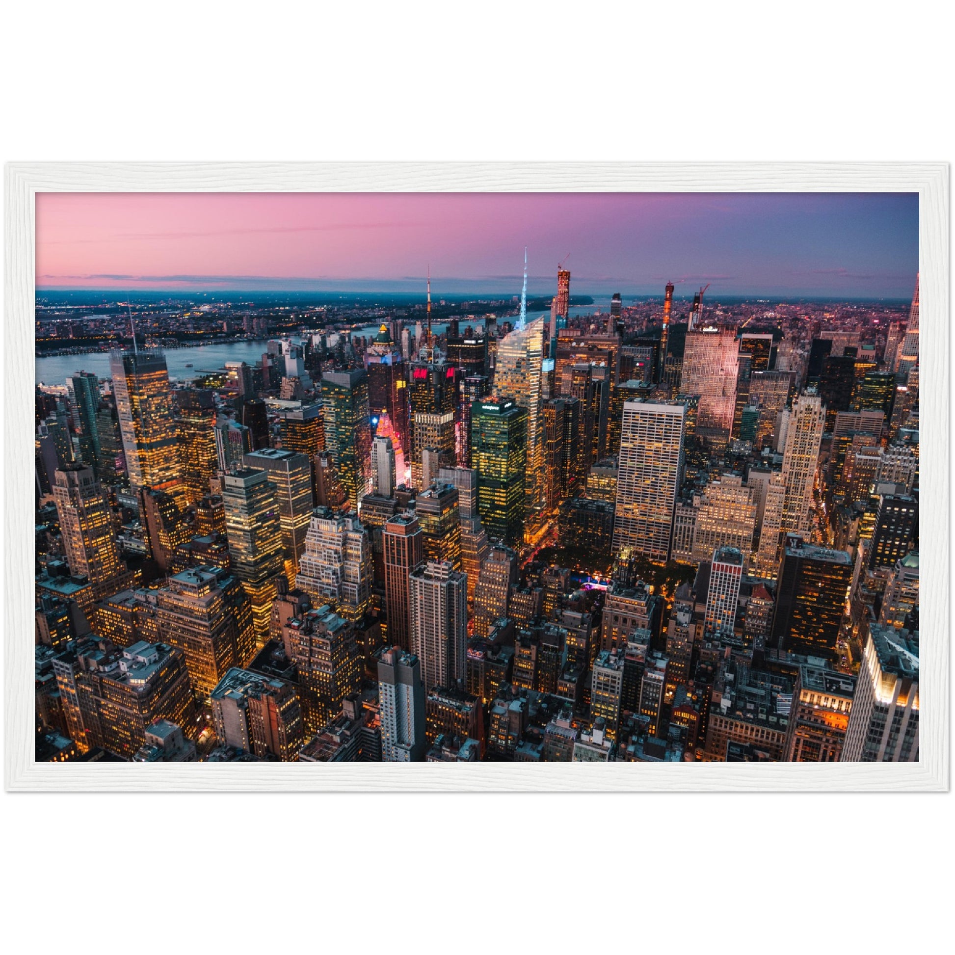 Manhattan Buildings Wall Art: Stunning aerial view of illuminated NYC skyscrapers at sunset.  Perfect city skyline decor.