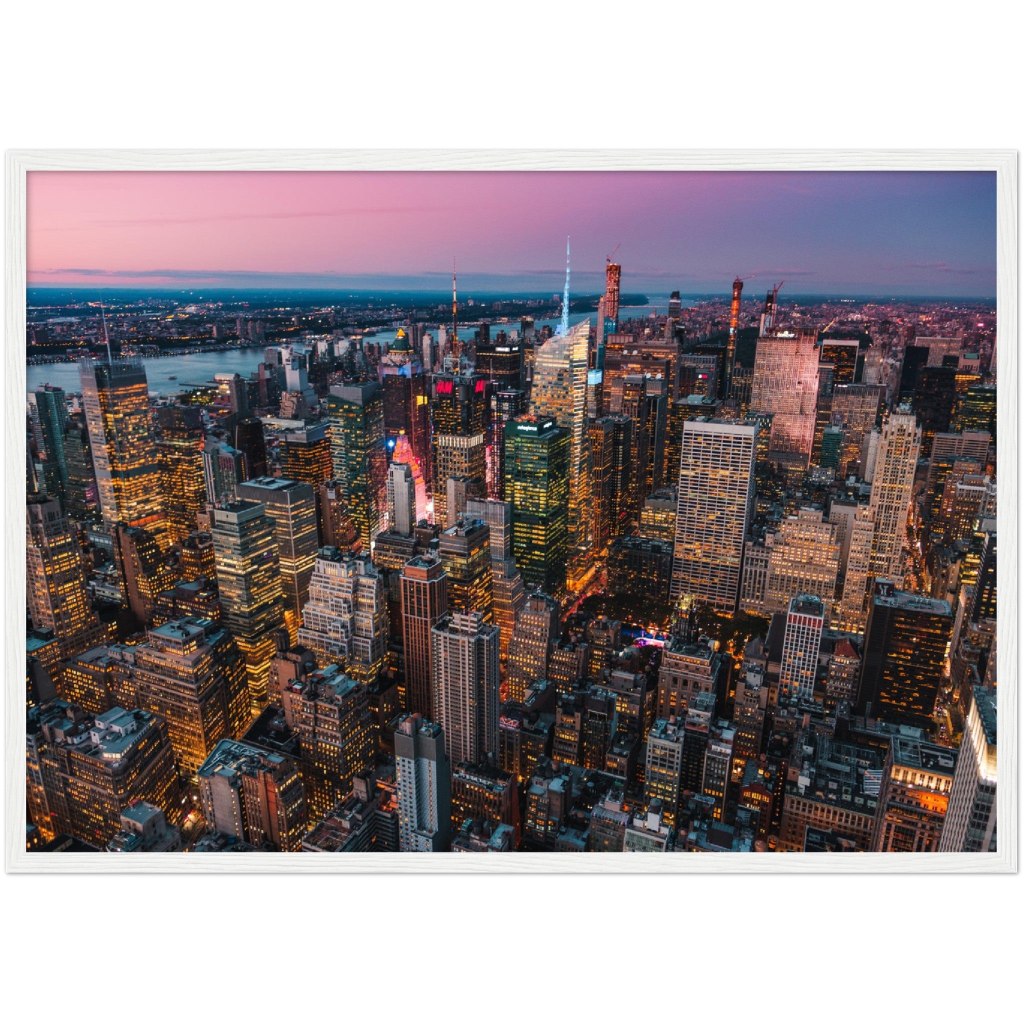 Manhattan Buildings Wall Art: Stunning aerial view of illuminated NYC skyscrapers at sunset. Perfect city skyline decor.