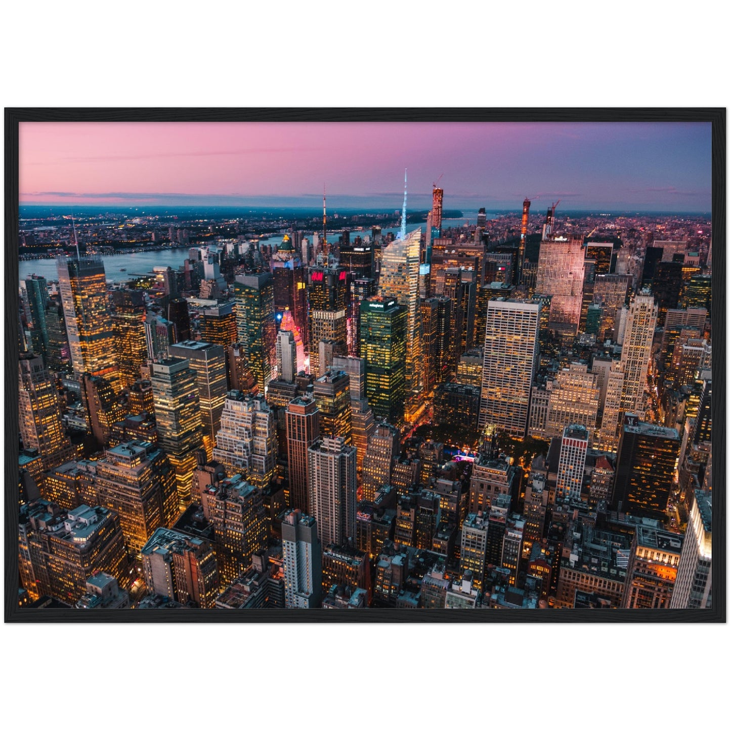 Manhattan Buildings Wall Art: Stunning aerial view of illuminated NYC skyscrapers at twilight.