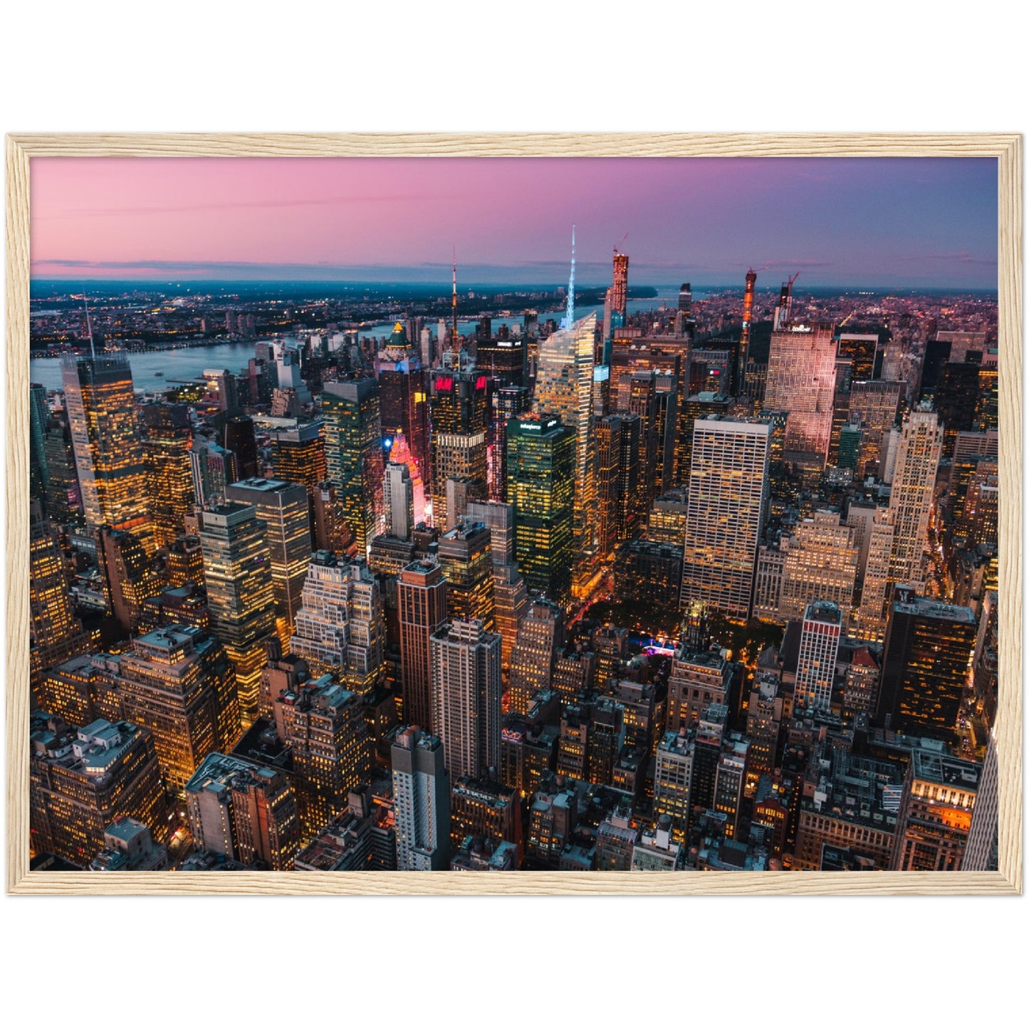 Manhattan Buildings Wall Art: Stunning aerial view of illuminated NYC skyscrapers at twilight.
